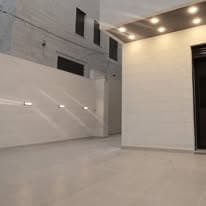 Finished room with recessed downlights and a stepped ceiling detail